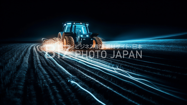 トラクターが畑を走る白い光る線で表現された写真