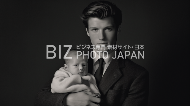愛に包まれたモノクロ写真素材！美形な白人男性が赤ちゃんを優しく抱く姿に心が温まる